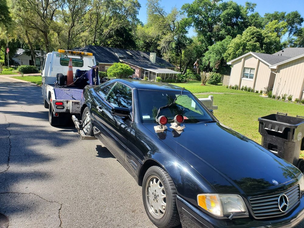 DLJ tow truck assisting a driver at their home in Orlando