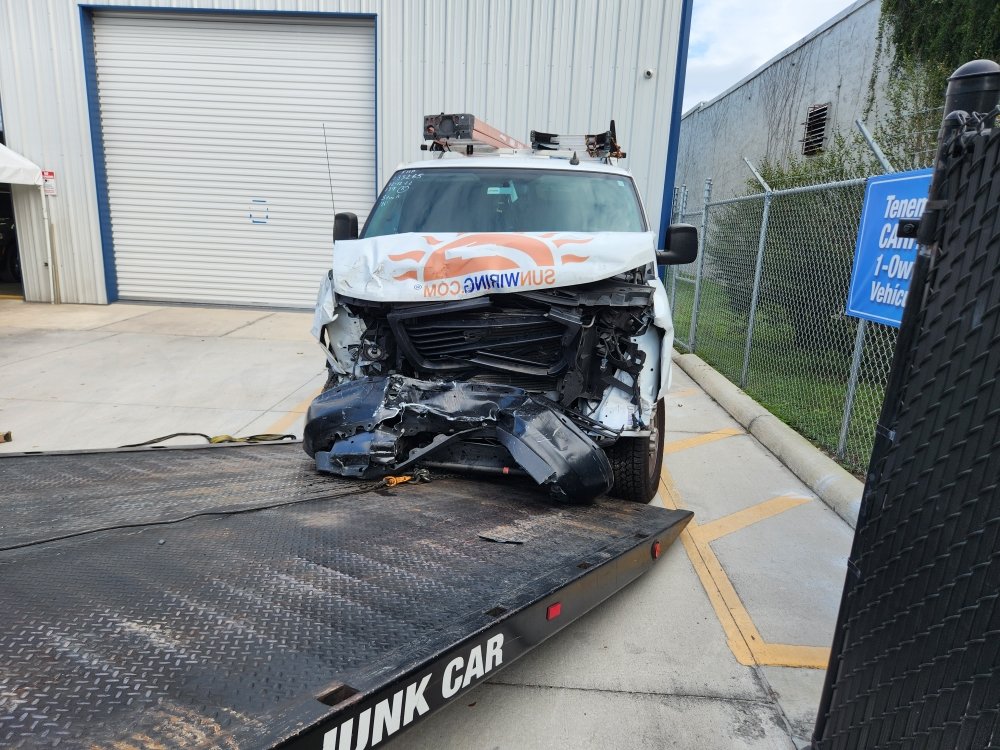 DLJ flatbed recovering a collision-damaged work van